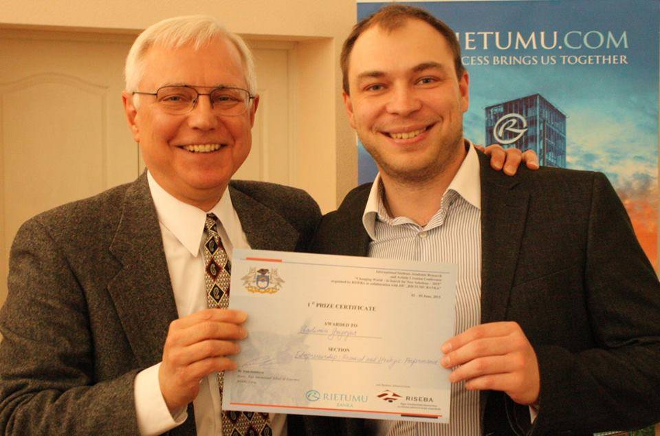 Gary Presenting to Winner of Student Conference Paper